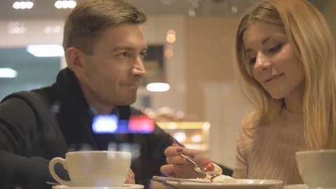 Romantic relationship. A young couple is in a cafe. Stock Footage 82924696
