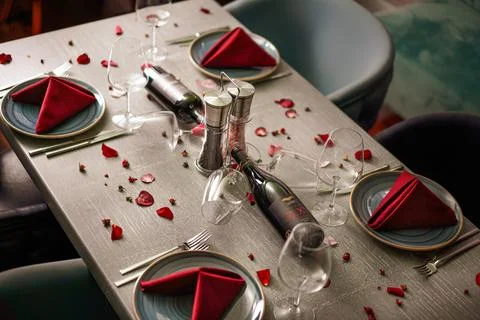 Romantic Restaurant Table Setup with Red Roses Stock Photos
