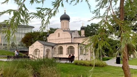 Romantic scene, couple sitting in front of Church of the Conception of St. A Stock Footage 235011160