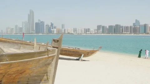 A romantic scene of a couple walking or relaxing on a beach with the stunni.. Stock Footage 308724052