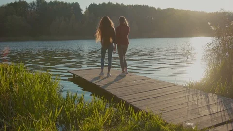 Romantic scene. Couple of young lovable girlfriends holding hands hugging Video stock 119495055