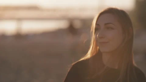 Romantic scene of a young and beautiful woman who is walking on the beach during Stock Footage 135059269