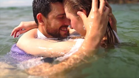 Romantic scene of a young couple under the beach water Stock Footage