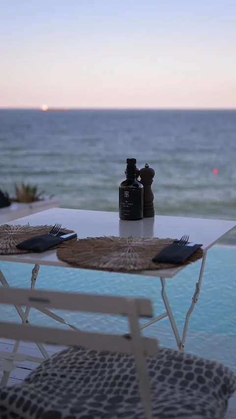 Romantic Seaside Dinner Table at Sunset in Italy Stock Footage 345688109