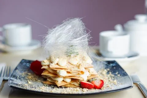 Romantic serving of Napoleon cake Stock Photos