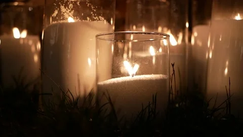 Romantic setting with burning candles in glass candlesticks  Stock Footage 160410322