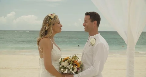 Romantic Shot of Couple Getting Married on Beach, Tropical Destination Wedding Stock Footage 112454080