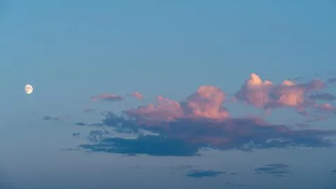 Romantic Sky with Light Clouds in Sunset Time with Moon. Sky with Clouds. Sunset Stock Photos