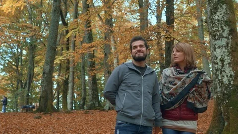 Romantic smiling couple in the forest in fall season Stock Footage 92774703