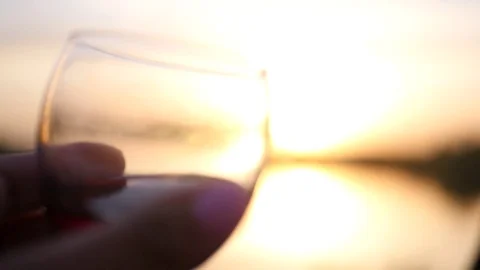 Romantic sunset and two clinking glasses with wine. slow motion. 1920x1080 Stock Footage 76215112