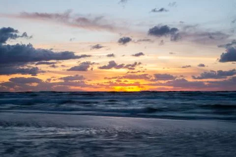 Romantic sunset on the beach Stock Photos