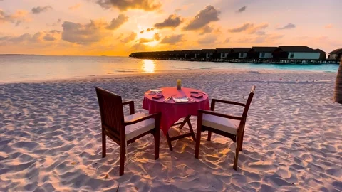 Romantic sunset dinner on the beach. Summer love, romance date on vacation Stock Footage 239005914