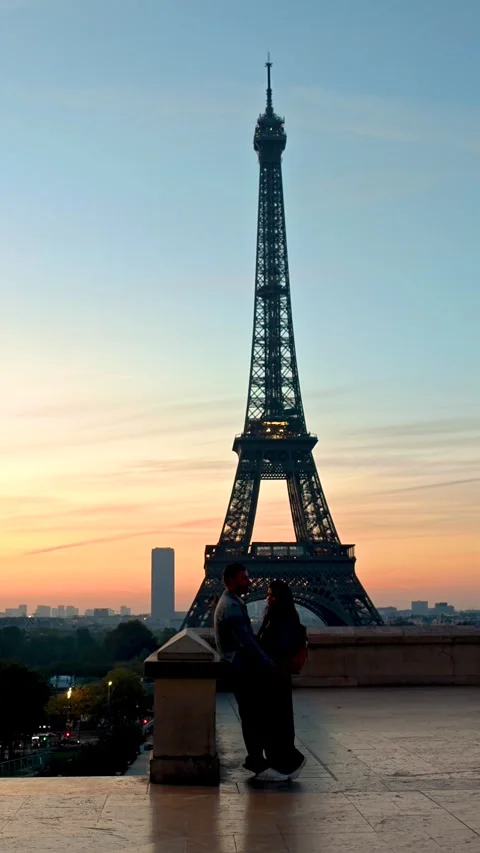Romantic sunset embrace by the Eiffel Tower in Paris, France Stock Footage 347262315