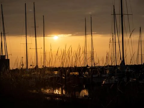 Romantic sunset at the harbor Stock-Fotos