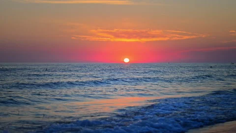 Romantic sunset over the ocean horizon with peaceful water and vivid clouds Stock Footage 335422000