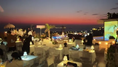 Romantic Sunset Rooftop Party with Bubbles and Purple Lighting in Xiamen. Vídeos de archivo 330378514