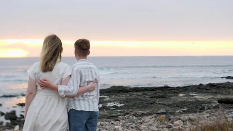 Romantic Sunset View by the Beach with Embracing Couple Stock Footage 317073058