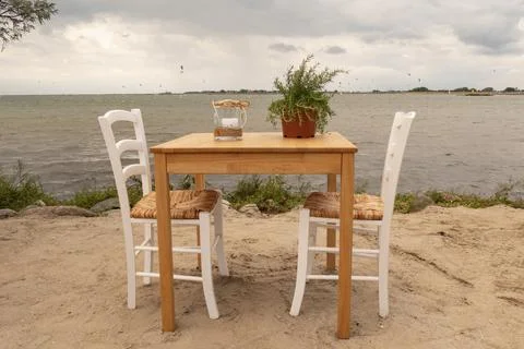 A romantic table on the sandy beach Stock Photos