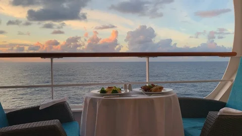 Romantic table setting on a private balcony suite on a cruise ship Stock Footage