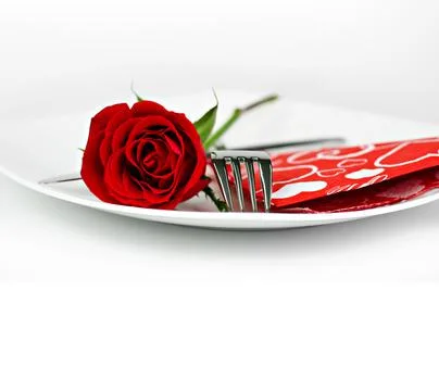 A romantic table setting with rose on a white background close up Stock Photos