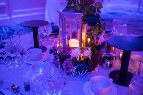 Romantic table setup for special event with candles indoor Stock Photos
