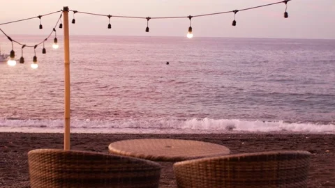 Romantic table for two on sunset on the beach Stock Footage 158827203