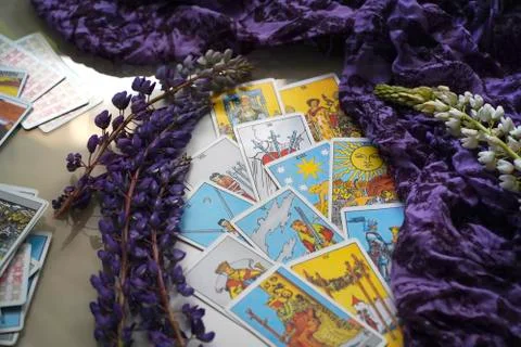 Romantic Tarot Setup Background. Tarot cards and Lupin flowers. Stock Photos