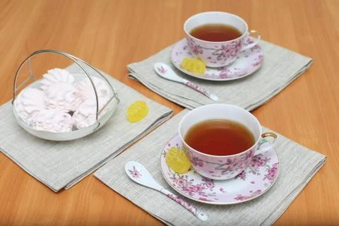 Romantic tea served in beautiful cups with marshmallow Stock Photos