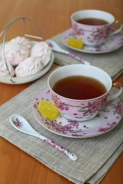 Romantic tea served in beautiful cups with marshmallow Stock Photos