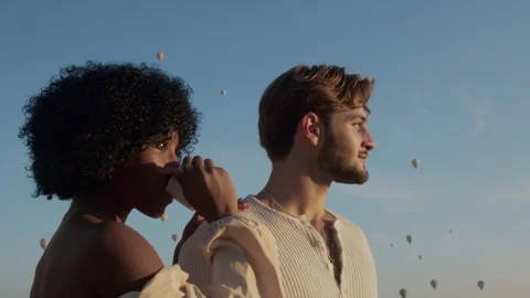 Romantic Vacation for an Interracial couple drinking tea Stock Footage 270073595
