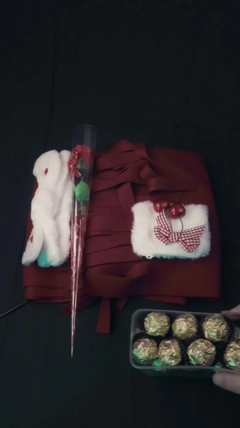 Romantic Valentine Gift Set with Red Corset Rose and Gold Chocolates Stock Footage 322606910