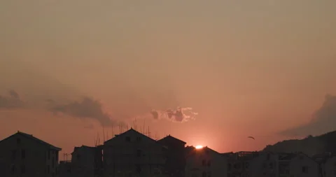 Romantic view on city roofs at sunset Stock Footage 169737948