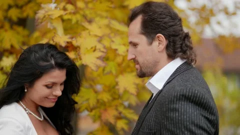 Romantic walk in park in fall day, beautiful woman and her boyfriend are playing Vídeos de archivo 165937082