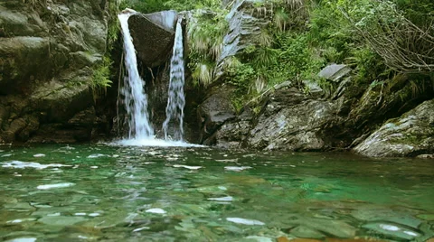 Romantic waterfall in the mountains. Stock Footage 32453371
