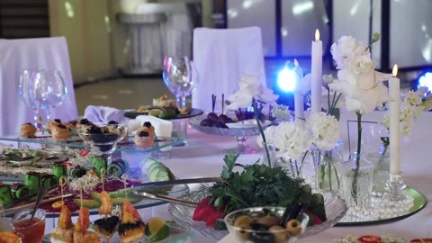 Romantic wedding banquet table setting with burning candles Stock Footage 340292723