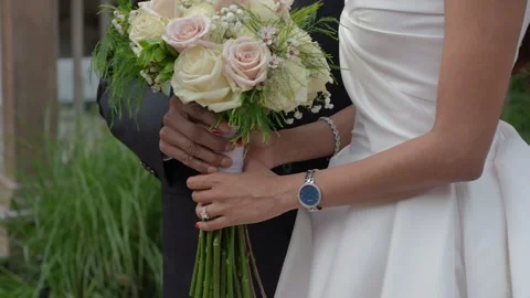 A Romantic Wedding Ceremony featuring an Exquisite Bouquet Exchange between the Stock-Footage 314575548