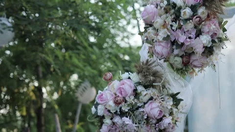 Romantic Wedding Decorations of Flowers, Objects and Letters in a Park Stock Footage 241322695
