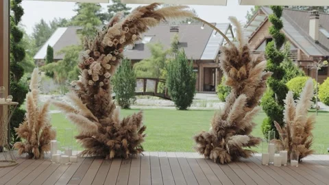 A romantic wedding setting with a stunning pampas grass arch Stock Footage 306168732
