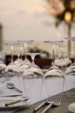 Romantic wedding table design at sunset outside on asian beach Stock Photos