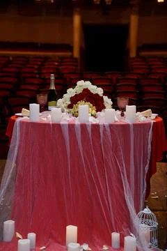 Romantic Wedding Table Setting in Theater: Red Roses, Champagne, Candles, S.. Stock Photos
