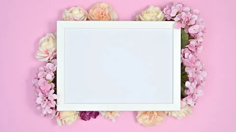 Romantic white frame for text or video with spring flowers around. Stop motion Stock Footage 166372776