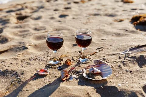 Romantic Wine on Beach Sand with Shells Coastal Leisure Scene 스톡 사진