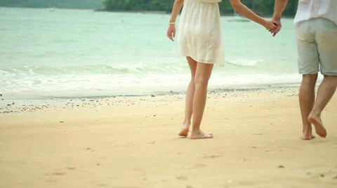 Romantic young couple on the beach Stock Footage 64254460