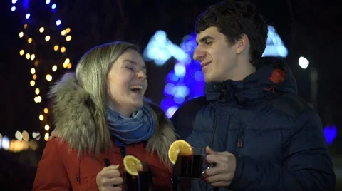 Romantic young couple drinking hot wine. Stock Footage 59163500