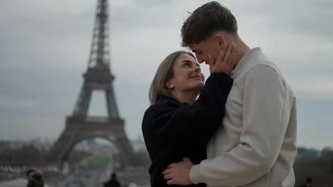 Romantic Young Couple Embracing With Eiffel Tower In Paris France Expressing Fotos Stock