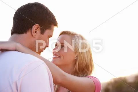 Romantic Young couple in love at sunset Stock Photos