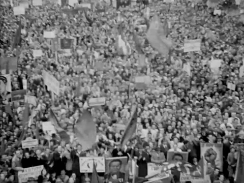 Rome - 1944: Massive crowd waves signs, flags during communist rally Video stock 219451684