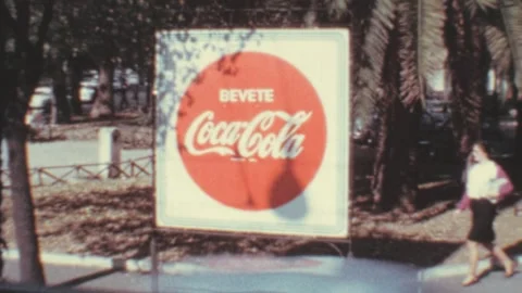 Rome - 1967: Large advertisement of Coca Cola logo in the street Stock Footage 196290546