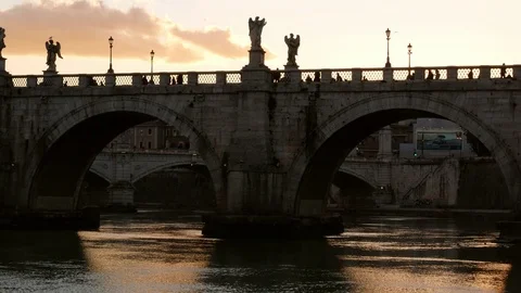 Rome, dramatic view of Saint'Angel Bridge at dusk with River and clouds Stock Footage 103629457