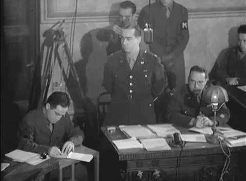 ROME, ITALY - 1945: Document review - Officer stands at carved courtroom table Stock Footage 344488591